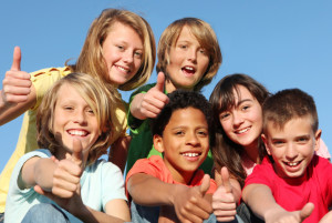 group of happy youth club or summer camp kids